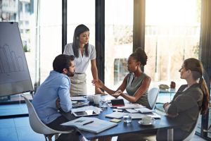 People, business meeting and audit in boardroom for budget plan and financial logistics. Corporate group, teamwork and company review with conversation and discussion about available resources.