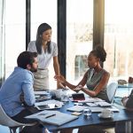 People, business meeting and audit in boardroom for budget plan and financial logistics. Corporate group, teamwork and company review with conversation and discussion about available resources.
