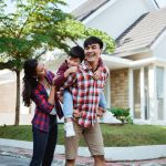 father piggyback ride with his son in front of the house playing enjoying their time in the morning
